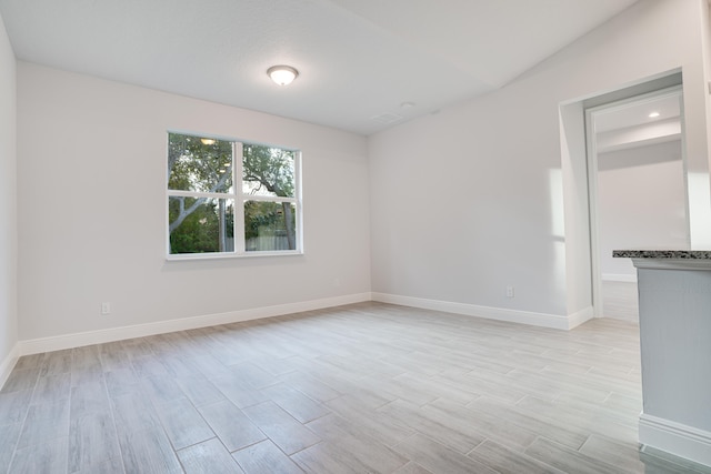 empty room with light wood-type flooring