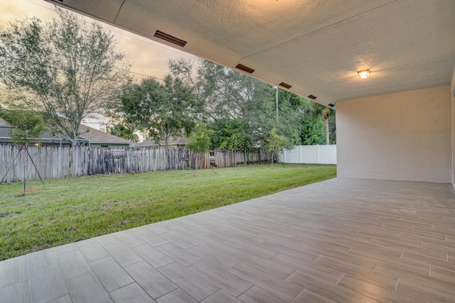 patio terrace at dusk with a yard