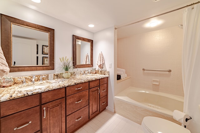 bathroom with dual sinks, large vanity, tile flooring, and toilet