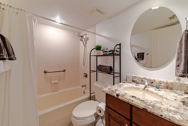 full bathroom featuring toilet, shower / bath combo with shower curtain, and vanity