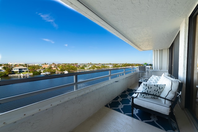 balcony featuring a water view