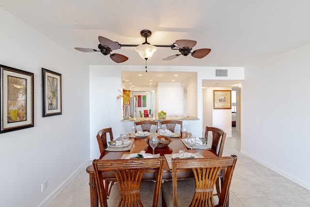 tiled dining room featuring ceiling fan