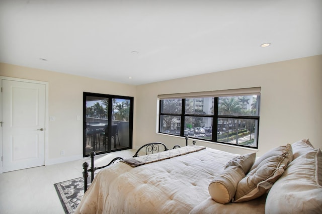 bedroom featuring multiple windows and access to exterior