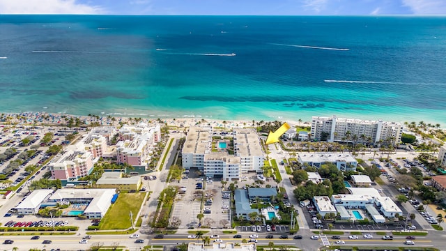 bird's eye view with a water view and a view of the beach