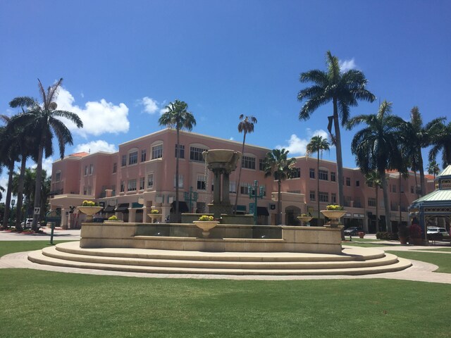 view of home's community with a lawn