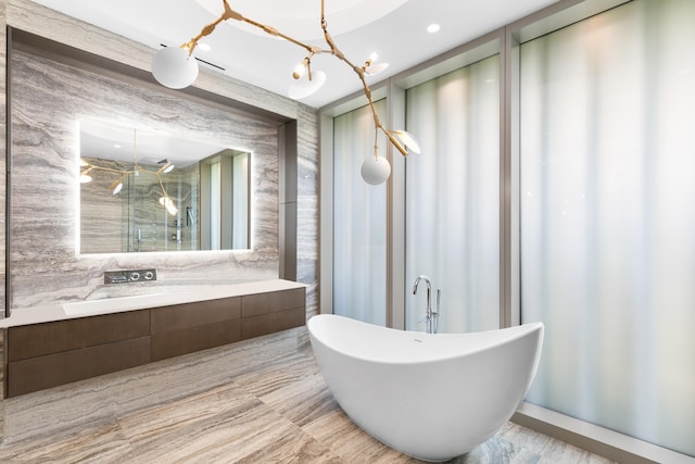 bathroom with an inviting chandelier