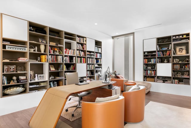 office space with light hardwood / wood-style flooring