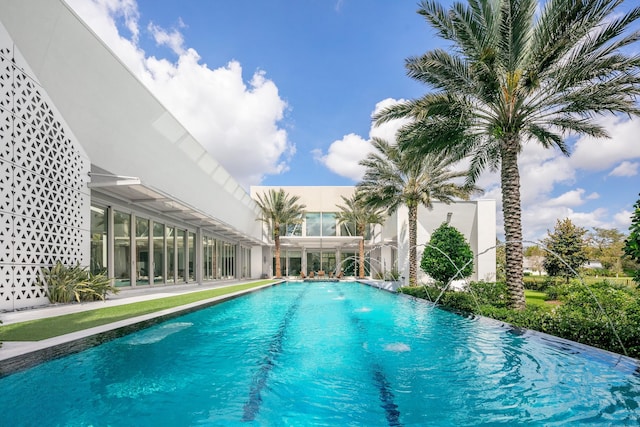 view of swimming pool featuring pool water feature