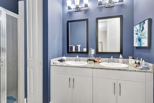 bathroom featuring oversized vanity and dual sinks