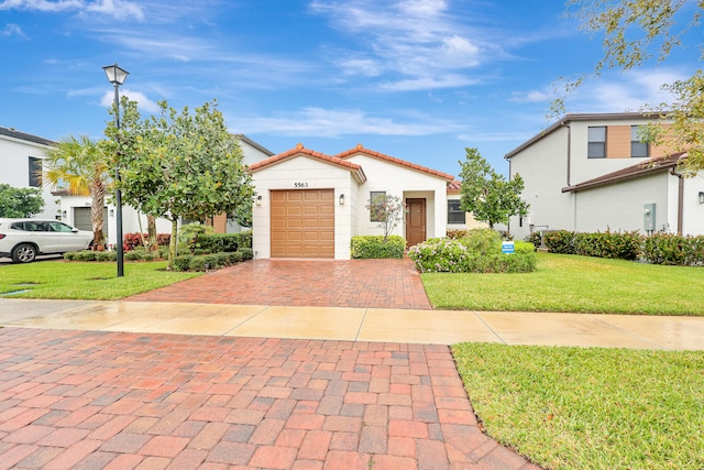 view of front facade with a front lawn and a garage