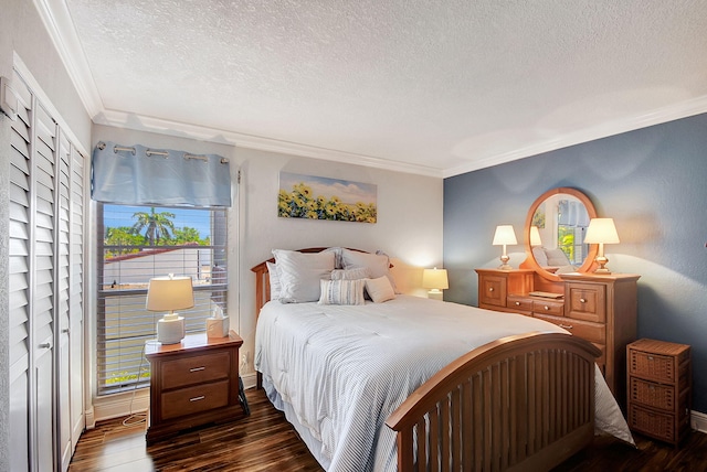 bedroom with a textured ceiling, multiple windows, crown molding, and dark wood-type flooring