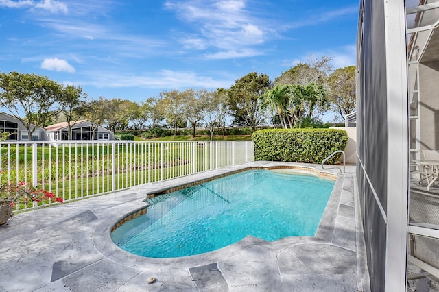 view of swimming pool with a patio and a lawn