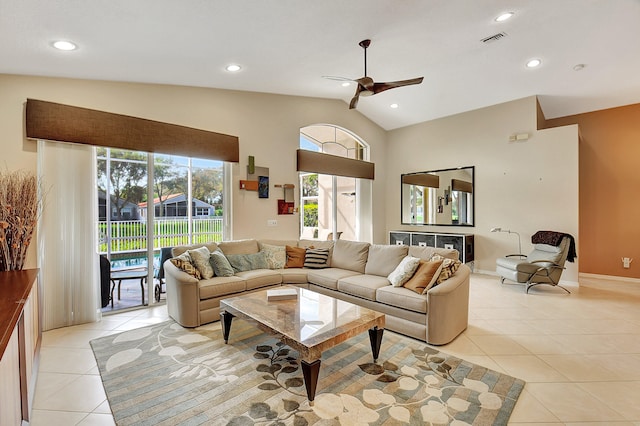 tiled living room featuring lofted ceiling and ceiling fan