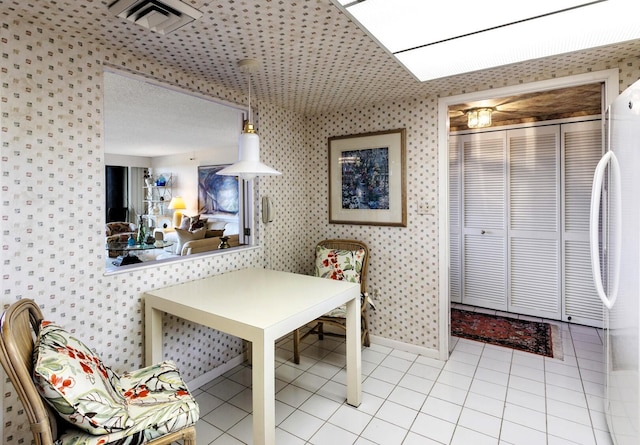 dining space with light tile patterned flooring