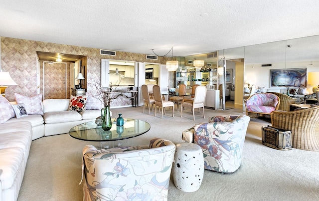 carpeted living room with a textured ceiling