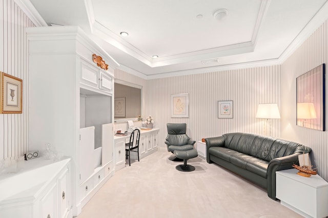 carpeted living room featuring a raised ceiling and crown molding