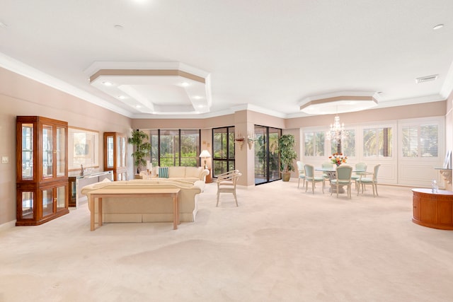 carpeted living room with a tray ceiling, crown molding, and a chandelier