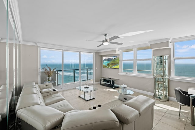 tiled living room with a water view, ceiling fan, and crown molding