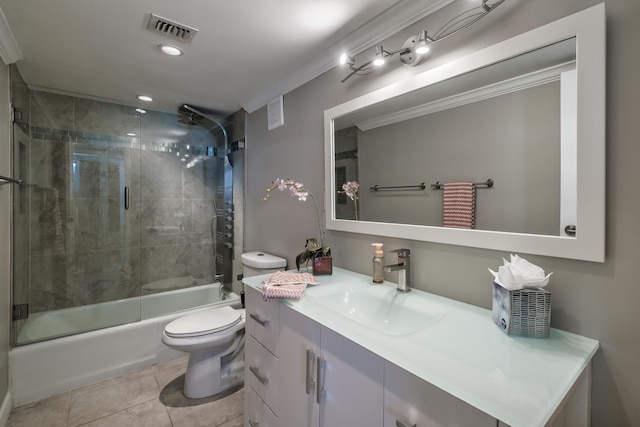 full bathroom with toilet, vanity, enclosed tub / shower combo, ornamental molding, and tile flooring