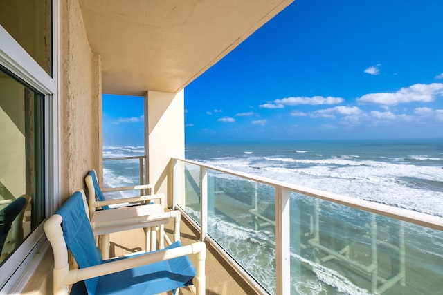 balcony featuring a water view