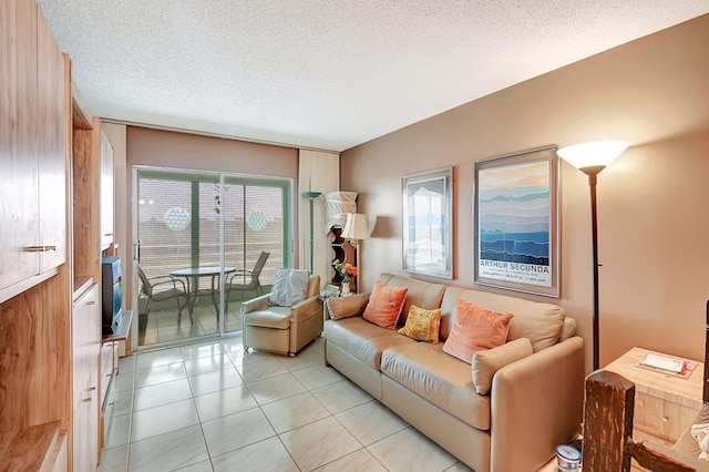 tiled living room featuring a textured ceiling