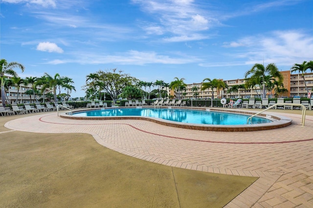 view of swimming pool with a patio area