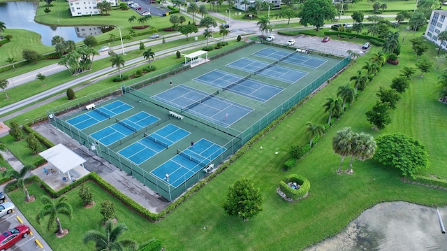 birds eye view of property with a water view