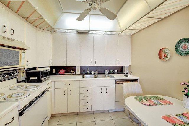 kitchen featuring white appliances, ceiling fan, sink, and light tile floors