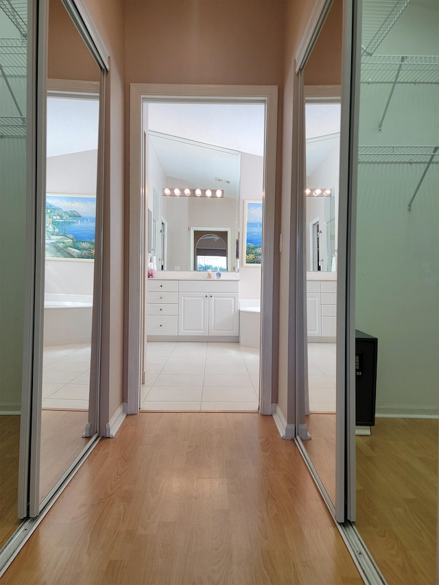 hallway with light wood-type flooring