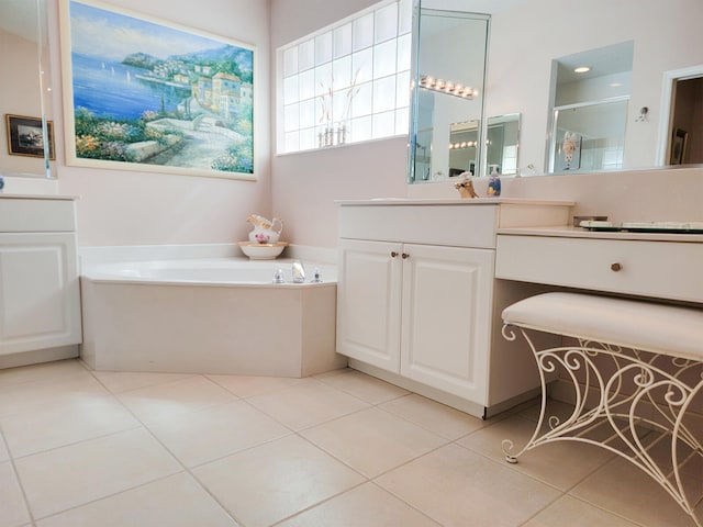 bathroom with tile patterned floors, vanity, and plus walk in shower