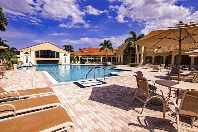 view of swimming pool featuring a patio