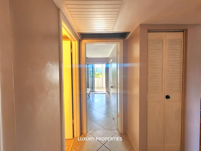 corridor featuring light tile floors