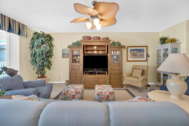 tiled living room featuring ceiling fan