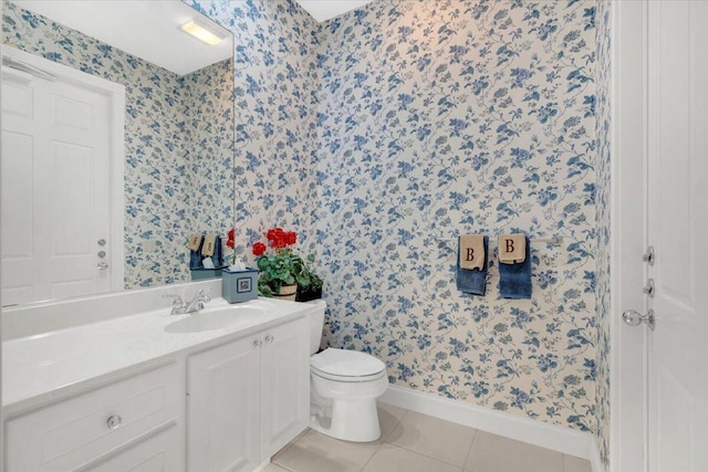 bathroom featuring vanity, tile floors, and toilet