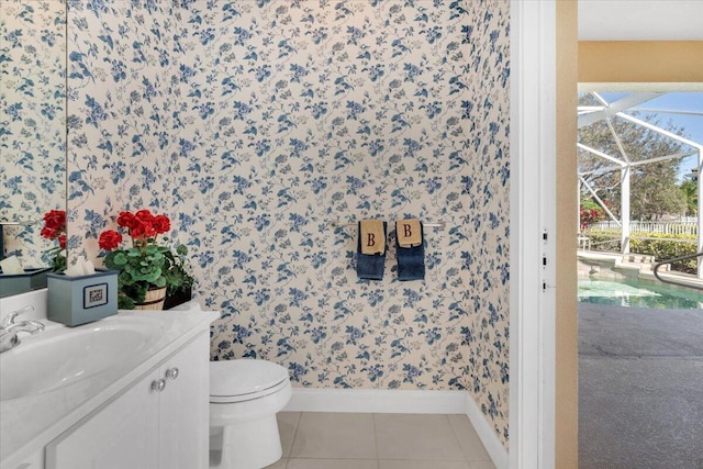 bathroom with toilet, tile floors, and vanity