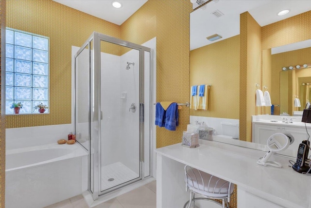 bathroom featuring vanity, tile flooring, a wealth of natural light, and separate shower and tub