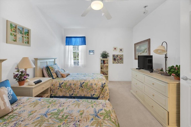 bedroom featuring light colored carpet and ceiling fan