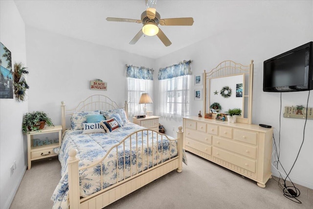 bedroom with light carpet and ceiling fan