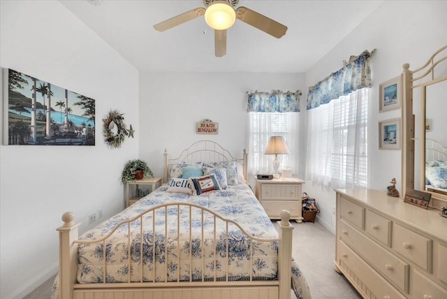 bedroom with light colored carpet and ceiling fan