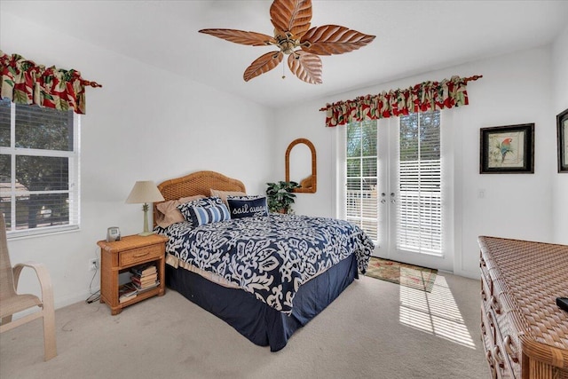 bedroom featuring french doors, light carpet, access to outside, and ceiling fan