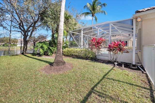 view of yard featuring glass enclosure