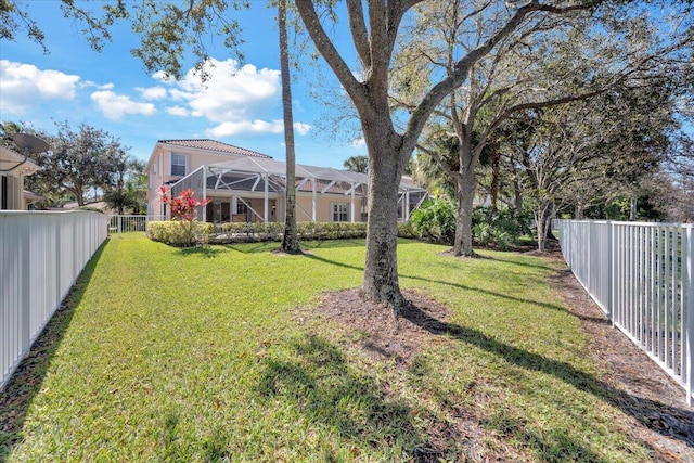 view of yard with a lanai