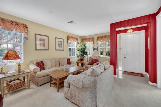 carpeted living room featuring a healthy amount of sunlight