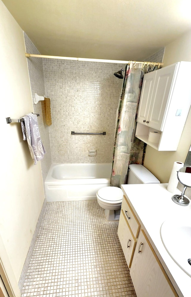 full bathroom featuring vanity, shower / tub combo, toilet, and tile patterned floors