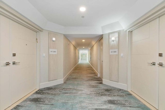 hallway with dark hardwood / wood-style floors