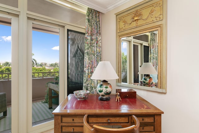 dining space featuring crown molding