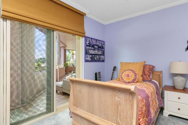 carpeted bedroom featuring crown molding