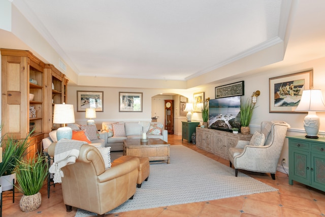 living room with ornamental molding and light tile flooring