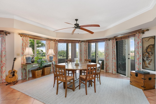 dining area with ceiling fan, ornamental molding, and light tile floors