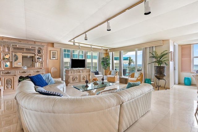 tiled living room featuring track lighting